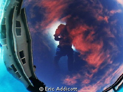 Bottom of pool sunset with surface reflection of photogra... by Eric Addicott 